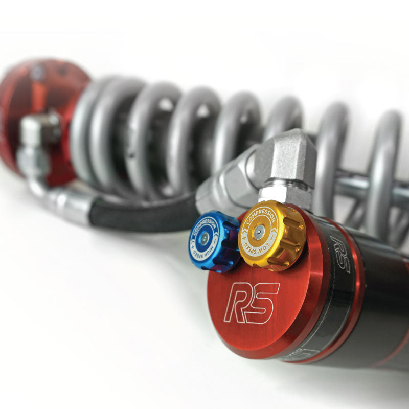 Ride Shocks coilover with dual piston adjusters. The bright red anodizing on Ride Shocks looks great along with the high and low speed compression adjuster knobs. Ride Shocks coilovers are pre-tuned for specific weight ranges to help your Tacoma drive smooth.