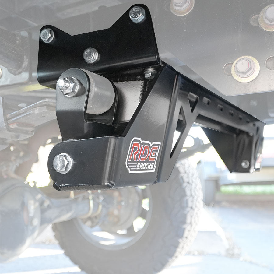 Ride Shocks Tacoma shackle hanger kit with cross bar installed.