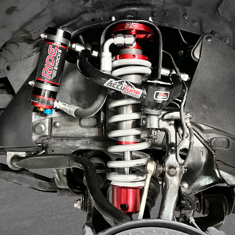 Toyota Tacoma front coilovers from Ride Shocks. These anodized red coilovers provide the ultimate in comfort both on and off-road due to the pre-tuned options. Pair your Ride Shocks with some AccuTune Offroad upper control arms for the ultimate suspension upgrade on your Tacoma.