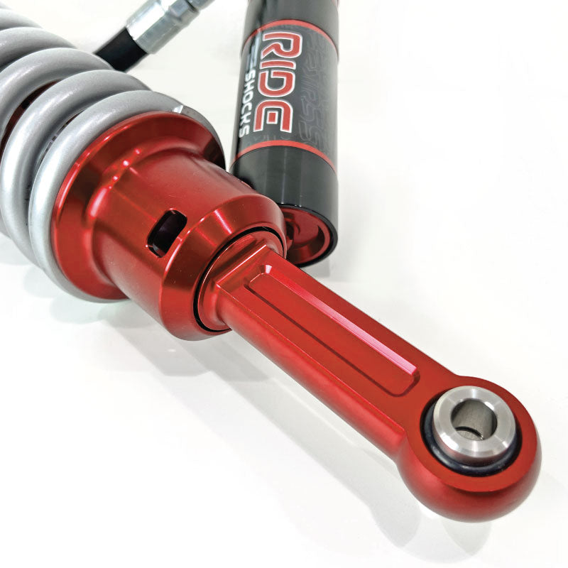 Ride Shocks front coilover lower mount for Toyota Tacoma. These aluminum red anodized parts are durable and designed to last for a long time. 4Runner front coilover is equipped with an FK rod end bearing.