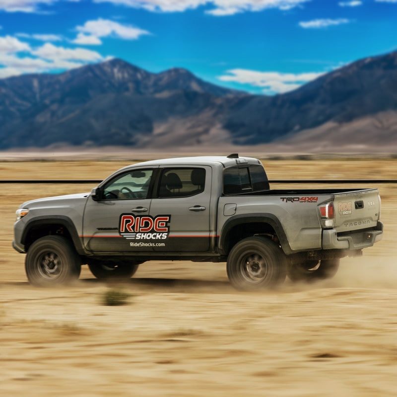 3rd Gen Tacoma blasting through the desert soaking up the aggressive terrain with Ride Shocks. Tacoma lift kit from Ride Shocks