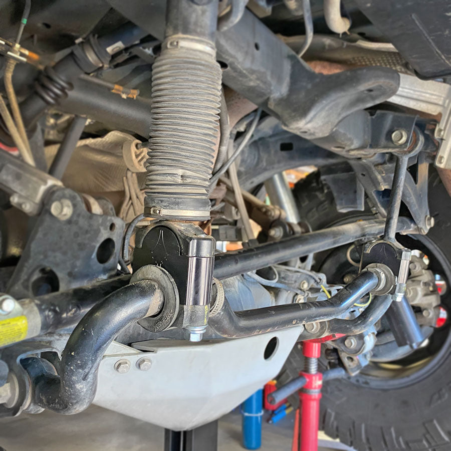 Rear KDSS drop brackets installed on the rear of a Toyota 4Runner. These Black Gate Customs brackets prevent the sway bar from contacting the track bar at full droop. If you want to run long travel shocks, these are highly recommended for those with KDSS equipped vehicles.